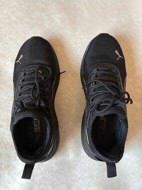 Puma Women’s Black Athletic Shoes with Gold Puma Logos